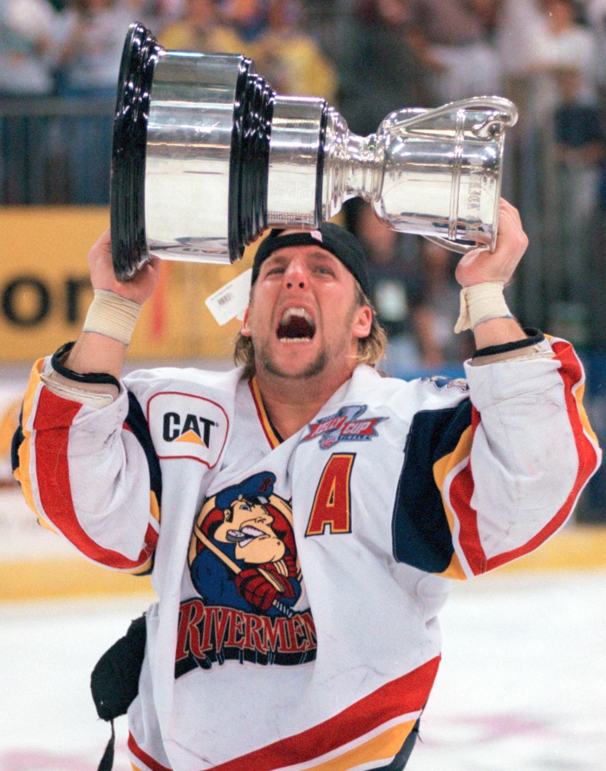 Jason Christie raised the Kelly Cup at Carver Arena after leading the Peoria Rivermen to a championship in 1999-2000. Now he's reached the NHL after 17 years of coaching in the minors, hired as an assistant coach at NHL Buffalo.