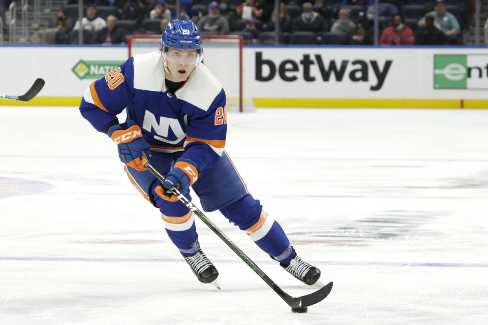 FILE - New York Islanders left wing Kieffer Bellows (20) skates with the puck during the second period of an NHL hockey game against the Edmonton Oilers, Saturday, Jan. 1, 2022, in Elmont, N.Y. The New York Islanders have signed defensemen Noah Dobson and Alexander Romanov to three-year contracts. The Islanders also announced Monday, Aug. 22, 2022, the signing of forward Kieffer Bellows to a one-year deal. (AP Photo/Corey Sipkin, File).