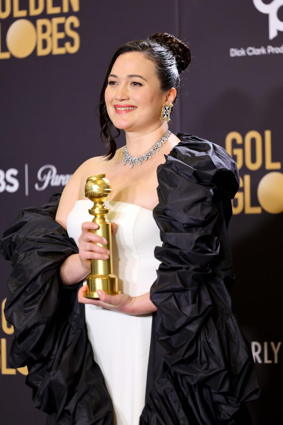 Lily Gladstone holds her Golden Globe at the 2024 awards ceremony.