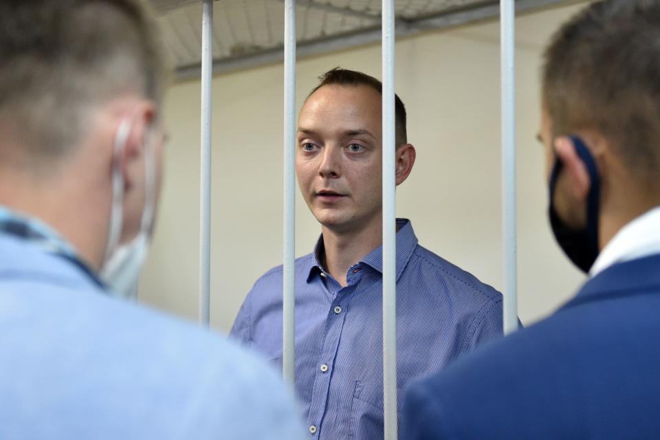 Ivan Safronov, a former journalist and aide to the head of Russia's space agency Roscosmos, detained on charges of treason for divulging state military secrets, stands inside a defendants' cage during a court hearing in Moscow, July 7, 2020. / Credit: VASILY MAXIMOV/AFP/Getty