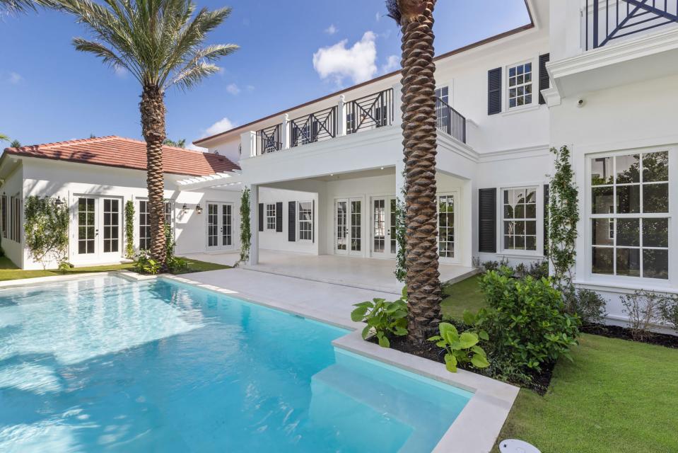 A covered loggia with a sun deck above it overlooks the pool area at a recently completed house developed on speculation at 130 Algoma Road. The property is listed at $23 million.