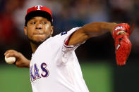 ARLINGTON, TX - OCTOBER 24: Neftali Feliz #30 of the Texas Rangers pitches in the ninth inning during Game Five of the MLB World Series against the St. Louis Cardinals at Rangers Ballpark in Arlington on October 24, 2011 in Arlington, Texas. The Rangers won 4-2. (Photo by Tom Pennington/Getty Images)
