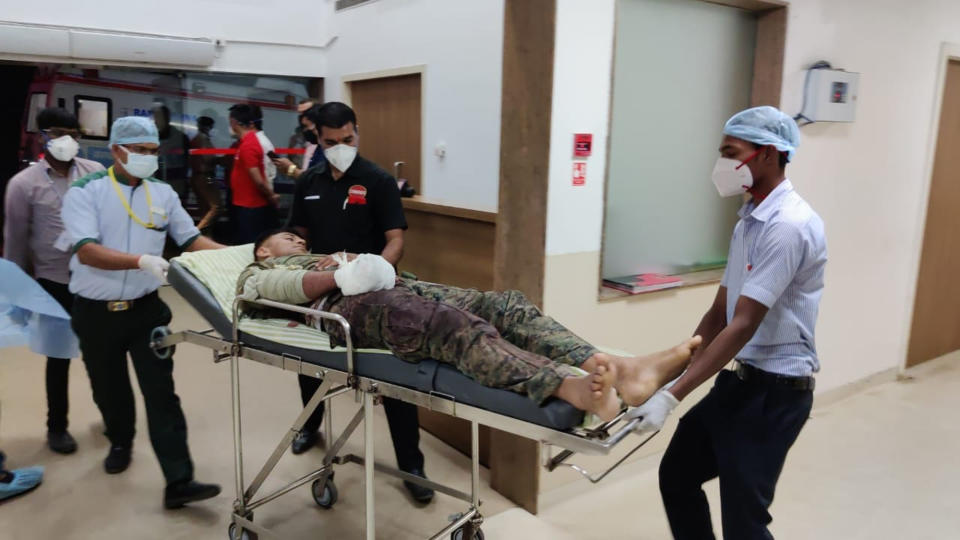 A paramilitary soldier injured in a gunbattle with Maoist rebels on Saturday is brought for treatment at a hospital in Raipur, India, Sunday, April 4, 2021. India on Sunday recovered the bodies of 20 police and paramilitary troops who were killed in a gunbattle with Maoist rebels a day earlier in the forests of the eastern Chhattisgarh state. (AP Photo)