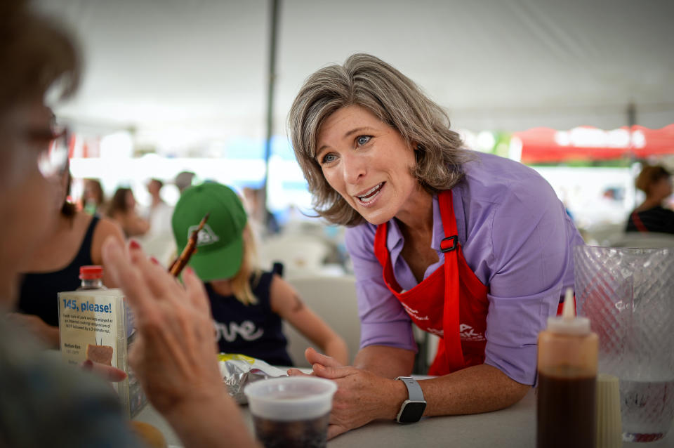 Sen. Joni Ernst talks to voters at the Iowa State Fair last August. Democrats are trying to capitalize on her suggestion that lawmakers reform Social Security "behind closed doors." (Photo: Caroline Brehman/Getty Images)