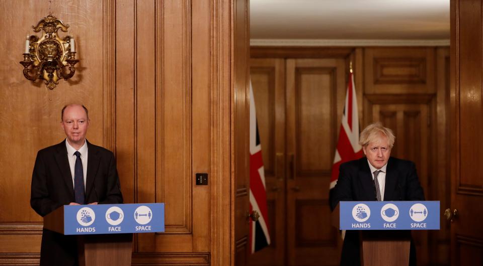 Britain's Prime Minister Boris Johnson (R) and Britain's Chief Medical Officer for England Chris Whitty (L) attend a virtual press conference inside 10 Downing Street in central London on December 16, 2020. - Prime Minister Boris Johnson resisted calls to tighten coronavirus restrictions over Christmas, as London faced stricter measures and concern mounted about case numbers. (Photo by Matt Dunham / POOL / AFP) (Photo by MATT DUNHAM/POOL/AFP via Getty Images)