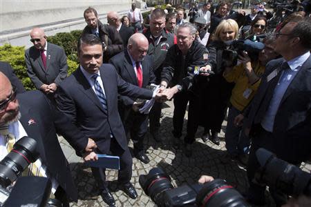 U.S. Representative Michael Grimm (R-NY) greets supporters following a news conference outside the Brooklyn Federal Courthouse in the Brooklyn Borough of New York April 28, 2014. REUTERS/Brendan McDermid