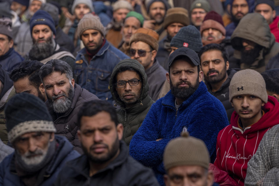 Kashmiris listen to a sermon by the priest before offering special prayers in the compound of Jamia Masjid in Srinagar, Indian controlled Kashmir, Friday, Jan. 12, 2024. Special congregational prayers known as "Salatul Istisqa" were organized by Anjuman Aquaf Jamia Masjid for respite from the prevailing dry weather conditions in Kashmir valley. (AP Photo/Dar Yasin)