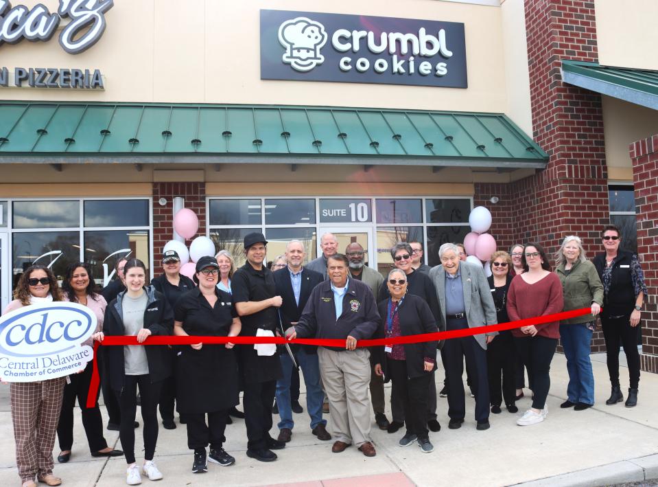 The Central Delaware Chamber of Commerce hosted a ribbon cutting ceremony to celebrate the upcoming opening of Crumbl Cookies in Dover on March 20, 2024.