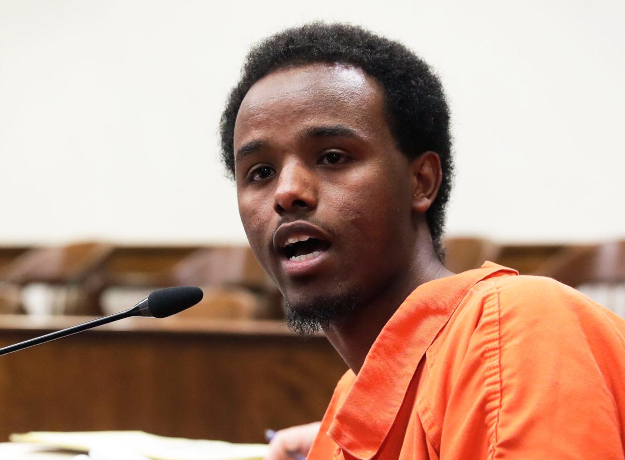 Abdi Ahmed speaks to victims' family members, some of whom walked out of the courtroom when he addressed them, during his sentencing hearing Sept. 19, 2022, in Brown County Circuit Court in Green Bay, Wis.