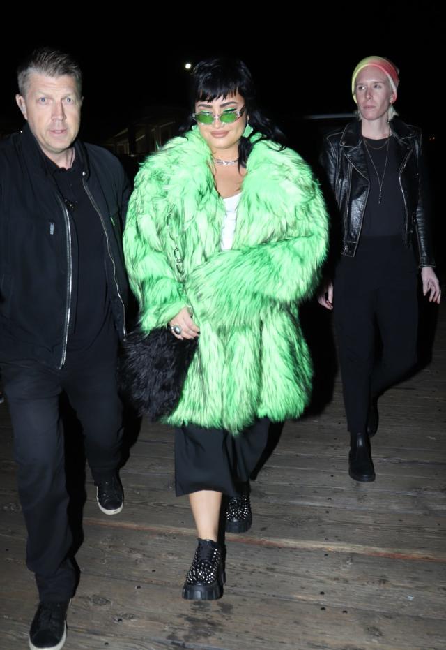 Demi Lovato is Festival-Ready in Lime Green Coat and Lug Sole Boots at  Paris Hilton's Wedding After Party