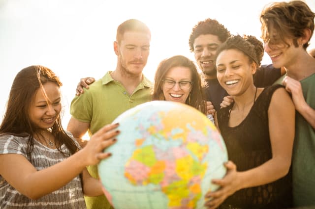 teenagers college student smiling with globe