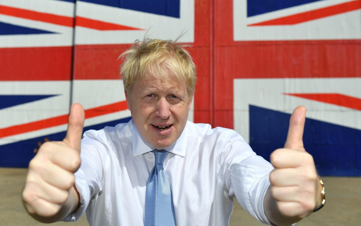 Boris Johnson gives the thumbs up in front of a Union Flag - Dominic Lipinski/Getty