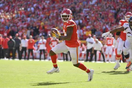 FILE PHOTO: Oct 28, 2018; Kansas City, MO, USA; Kansas City Chiefs wide receiver Sammy Watkins (14) catches a pass and runs in for a touchdown during the second half against the Denver Broncos at Arrowhead Stadium. Mandatory Credit: Denny Medley-USA TODAY Sports/File Photo