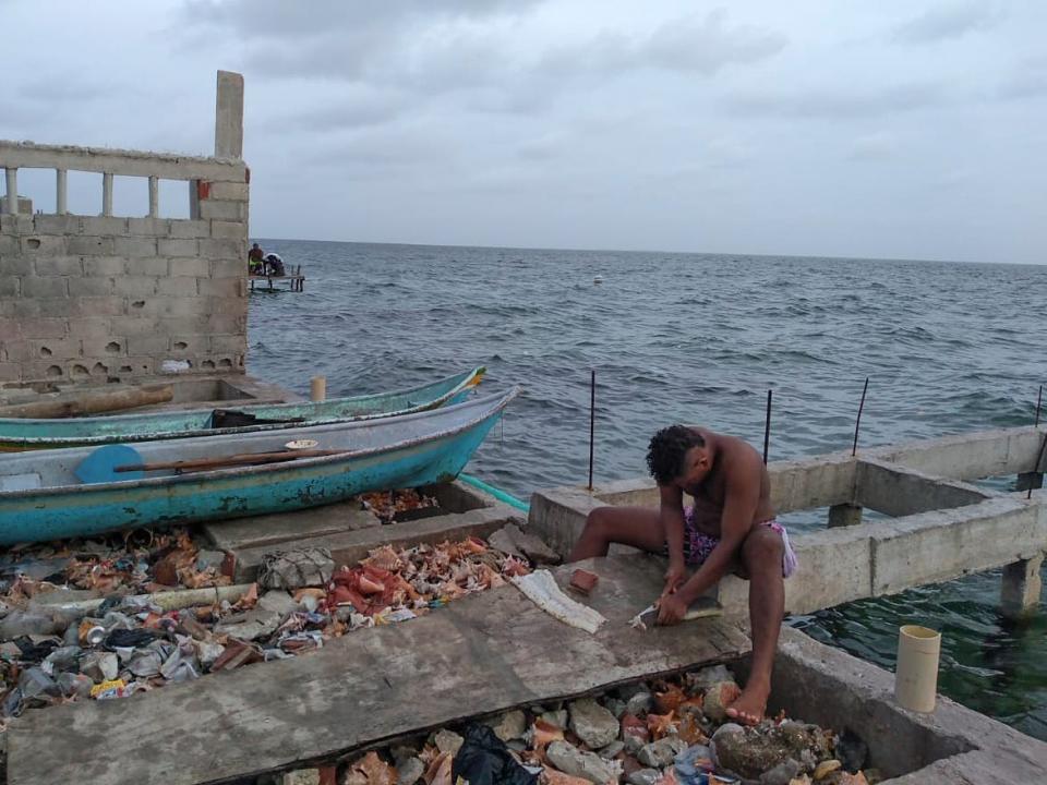 A man cuts fish at Santa Cruz del Islote island, located in the Colombian Caribbean.