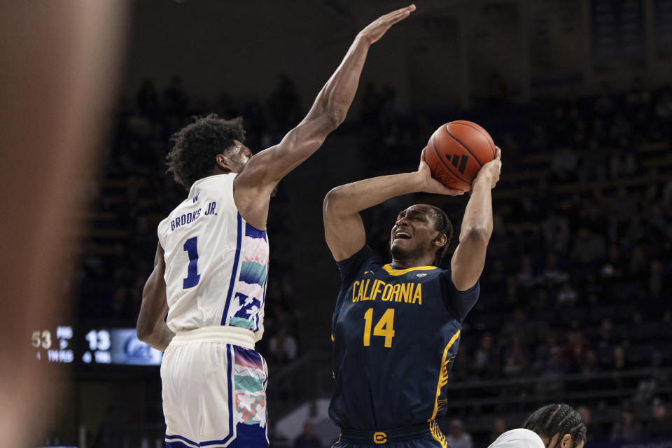 California forward Grant Newell shoots against Washington forward Keion Brooks Jr. during the first half of an NCAA college basketball game Saturday, Feb. 17, 2024, in Seattle. California won 82-80. (AP Photo/Stephen Brashear)