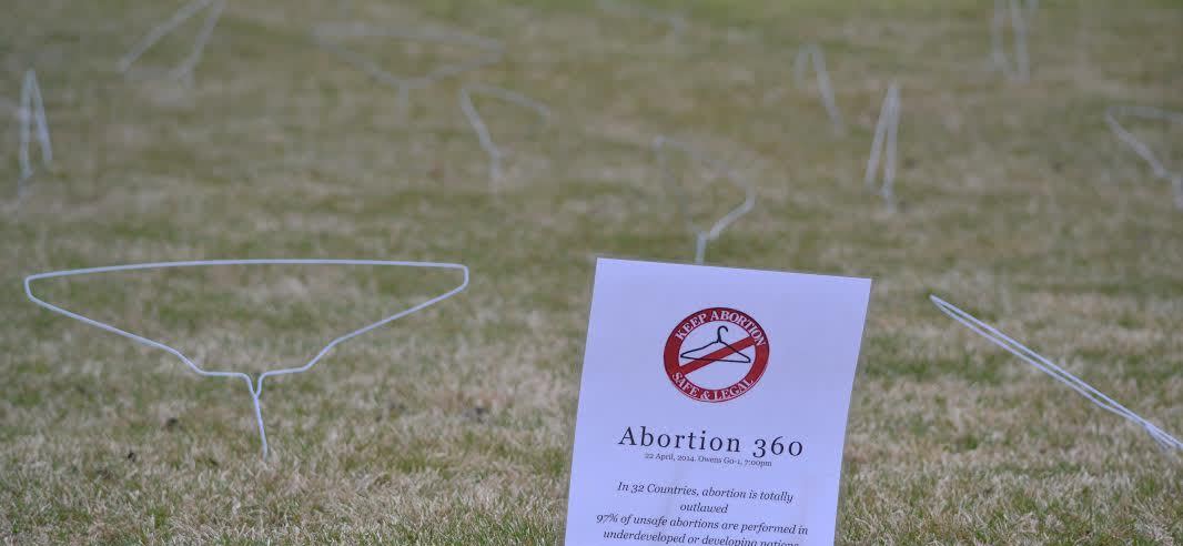 Socialists glorify abortion with WIRE COAT HANGER display on college lawn