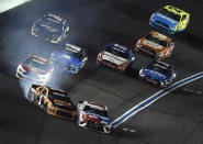 Kurt Busch (1) hits Kyle Busch (18) during the NASCAR Cup Series auto race at Charlotte Motor Speedway in Concord, N.C., Sunday, May 26, 2019. (AP Photo/Mike McCarn)