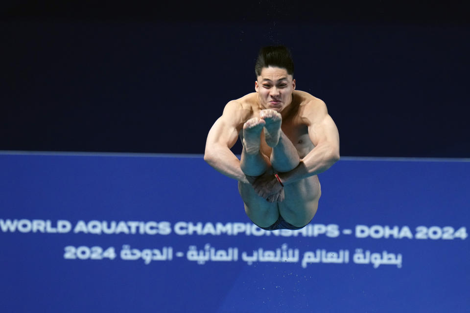 Osmar Olvera Ibarra of Mexico makes a dive during the men's 1m springboard finals at the World Aquatics Championships in Doha, Qatar, Saturday, Feb. 3, 2024. (AP Photo/Hassan Ammar)