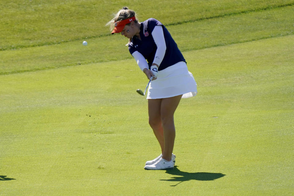 Auburn golfer Anna Foster hits onto the seventh green during the NCAA college women's golf championship semifinal at Grayhawk Golf Club, Tuesday, May 24, 2022, in Scottsdale, Ariz. (AP Photo/Matt York)