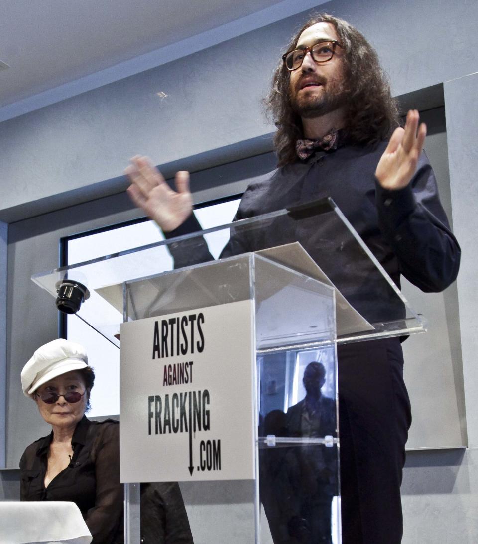 Yoko Ono, left, listens as her son Sean Lennon speaks during a news conference to launch a coalition of artists opposing hydraulic fracturing on Wednesday, Aug. 29, 2012 in New York. The formation of the group, called Artists Against Fracking, comes as New York Gov. Andrew Cuomo decides whether to allow shale gas drilling using high-volume hydraulic fracturing called hydrofracking. The group says such drilling is harmful and poses the threat of contamination. They say they want to spread awareness of the issue through "peaceful democratic action." Cuomo is expected to allow drilling to begin on a limited basis near the Pennsylvania border. The group is comprised of 146 members including Lady Gaga, Paul McCartney and Alec Baldwin. (AP Photo/Bebeto Matthews)