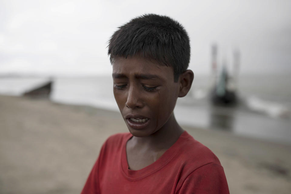 A young Rohinga boy cries after the wooden boat he was traveling on from Myanmar crashed into the shore, Sept. 12, 2017, in Dakhinpara, Bangladesh. (Photo: Dan Kitwood via Getty Images)