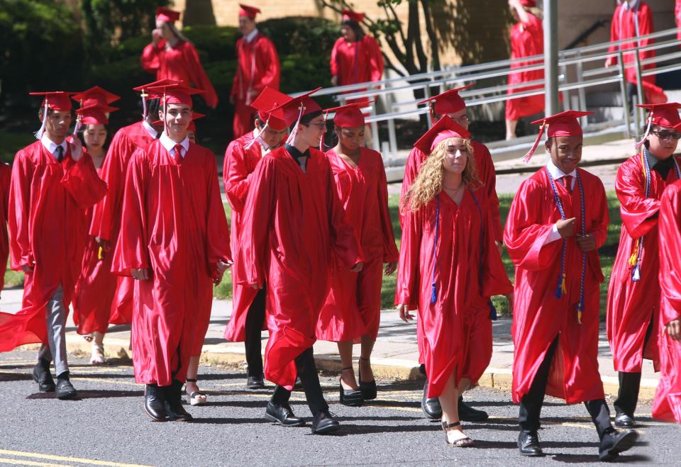 The 2022 graduates of St. Thomas Aquinas High School, Edison, process into Church of the Sacred Heart in South Plainfield, where their Wednesday, May 25, commencement ceremony was held.