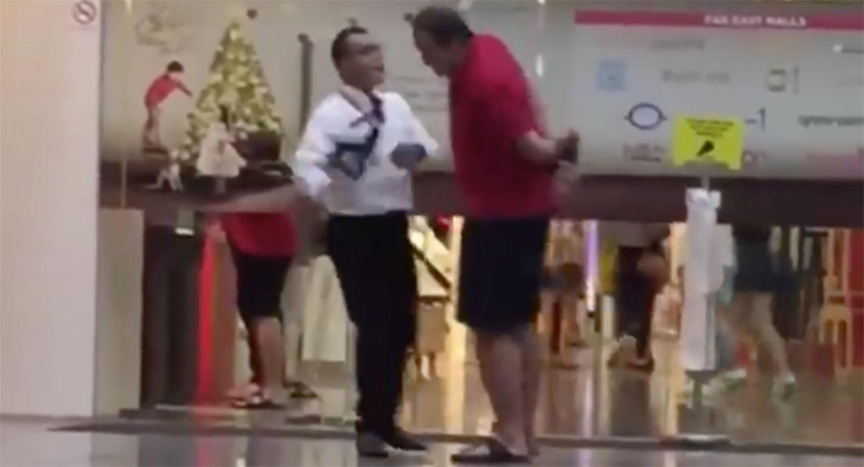 Security guard slaps man outside The Central mall at Clarke Quay. (PHOTO: Facebook screenshot)