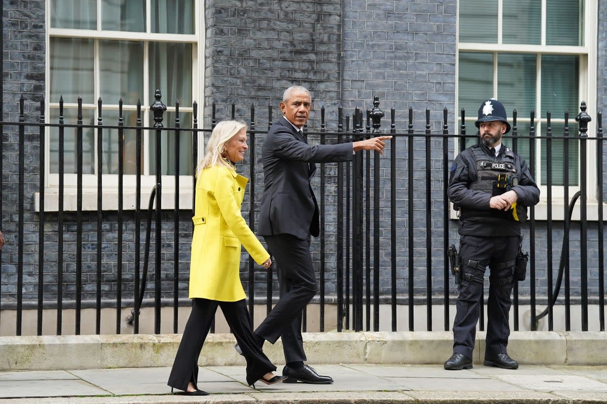 Former US president Barack Obama walks with United States ambassador to the United Kingdom Jane Hartley, leave following a meeting at 10 Downing Street (PA Wire)