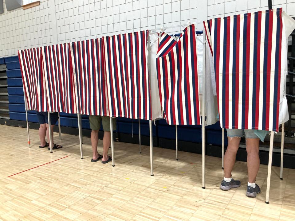 Voters in Essex mark their primary election ballots on Aug. 9, 2022.