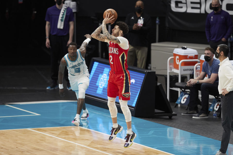 New Orleans Pelicans guard Lonzo Ball (2) attempts a 3-point shot during the second half of the team's NBA basketball game against the Charlotte Hornets on Sunday, May 9, 2021, in Charlotte, N.C. (AP Photo/Brian Westerholt)