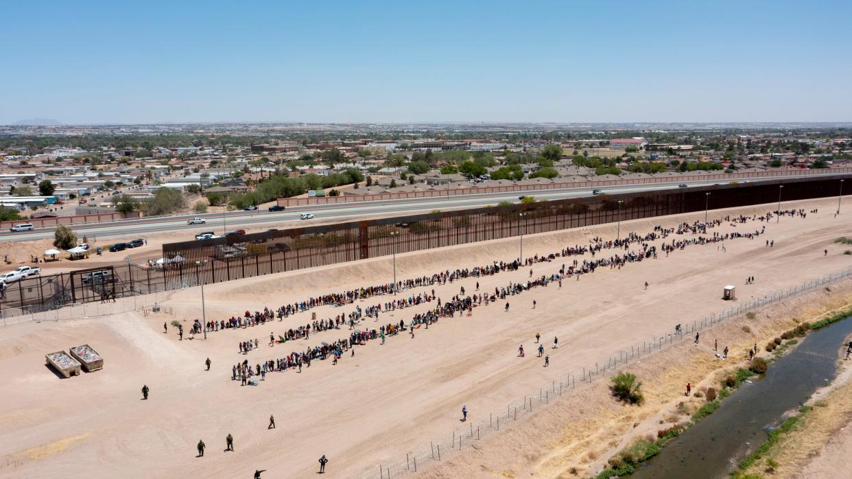 Migrants line up on gate 42 as they await to be processed by Customs and Border Protection on the last day of Title 42 on Thursday, May 11, 2023 in El Paso, Texas. 