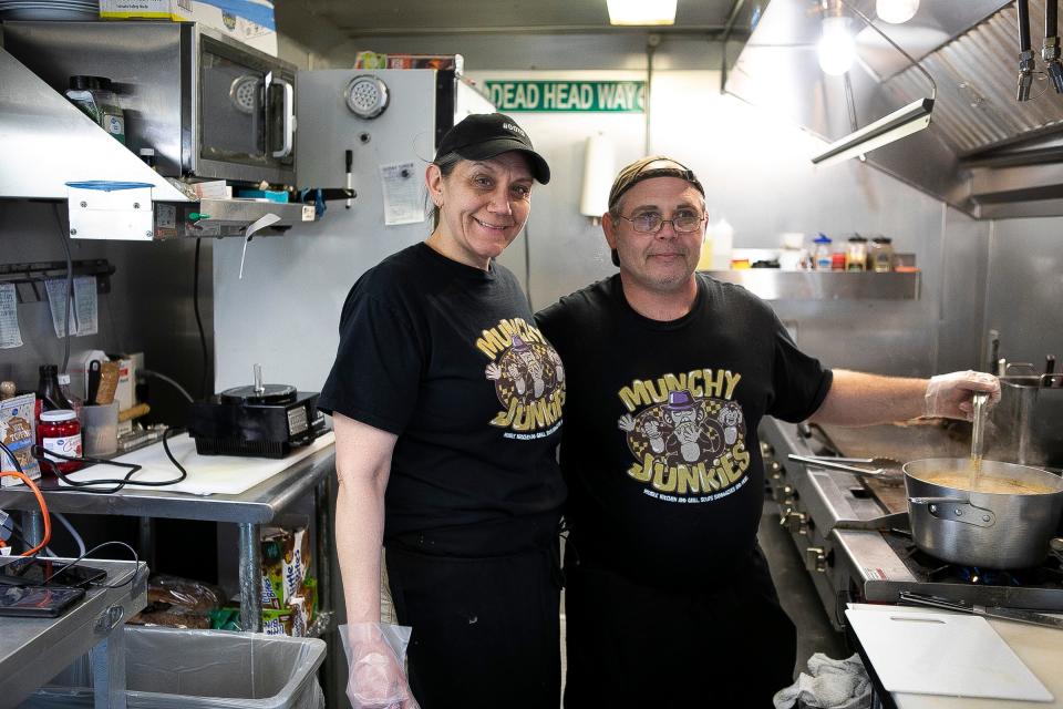 Owners Angie Mowery and Chris Daugherty stand inside of the Munchy Junkies on April 17, 2023, in Lancaster, Ohio.