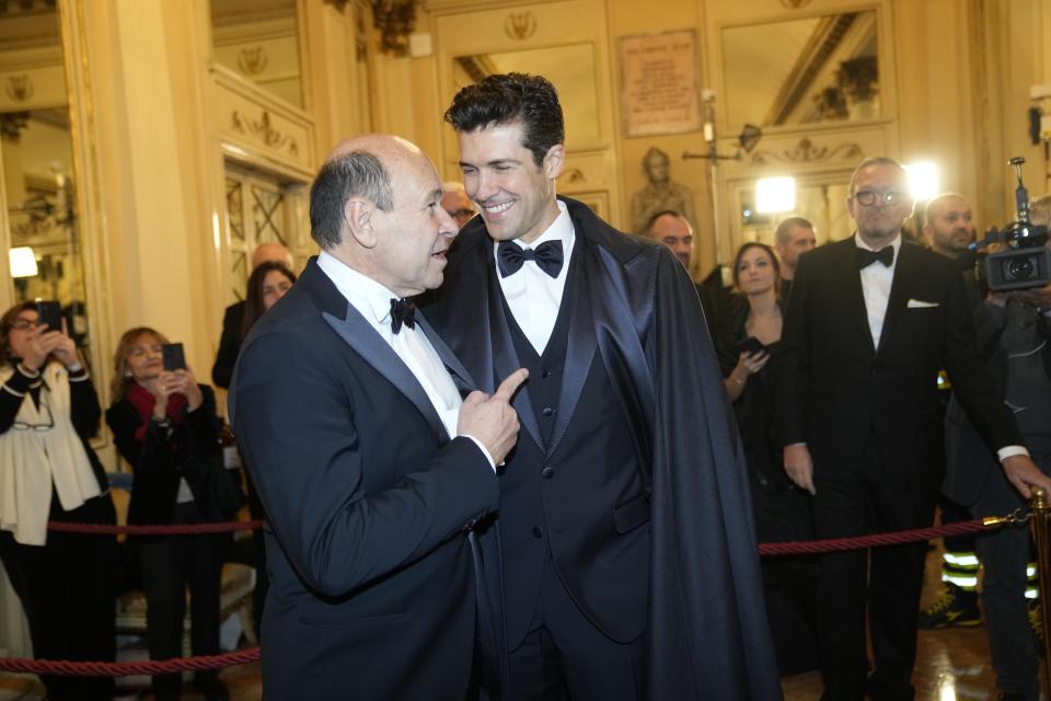Roberto Belle, right, and La Scala CEO and Artistic Director Dominique Meyer arrive to attend La Scala opera house's gala season opener, Giuseppe Verdi's opera 'Don Carlo' at the Milan La Scala theater, Italy, Thursday Dec. 7, 2023. The season-opener Thursday, held each year on the Milan feast day St. Ambrose, is considered one of the highlights of the European cultural calendar. (AP Photo/Luca Bruno)