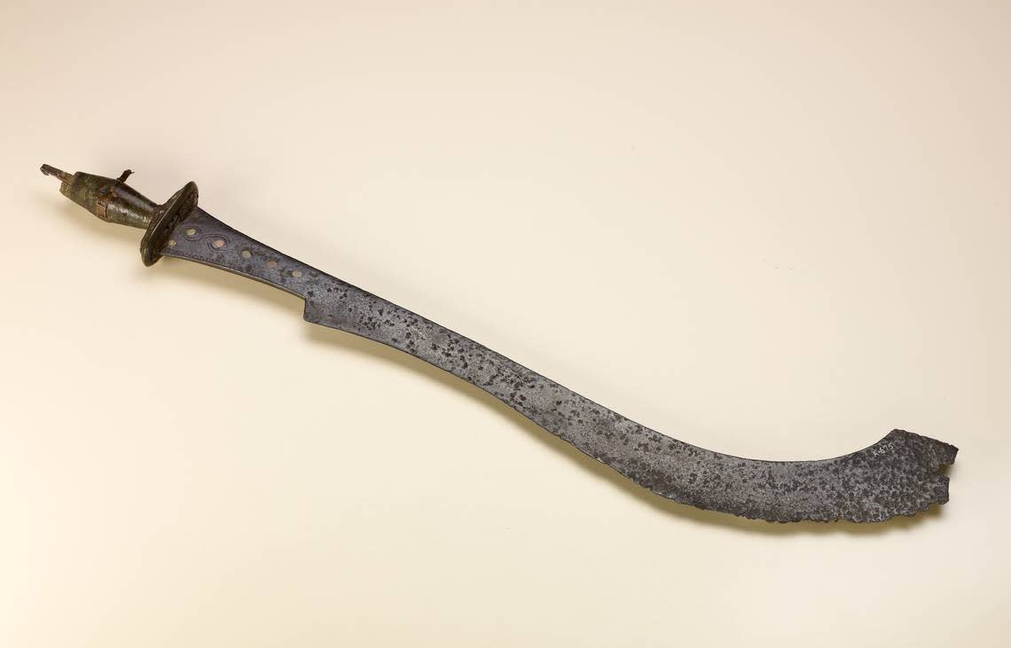 Ceremonial 19th century sword from the Benin Kingdom, made of iron and decorated with a linear design.