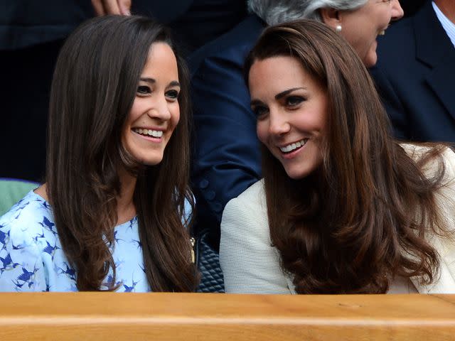 <p>LEON NEAL/AFP/Getty</p> Kate Middleton with her sister Pippa Middleton at the 2012 Wimbledon Championships tennis tournament