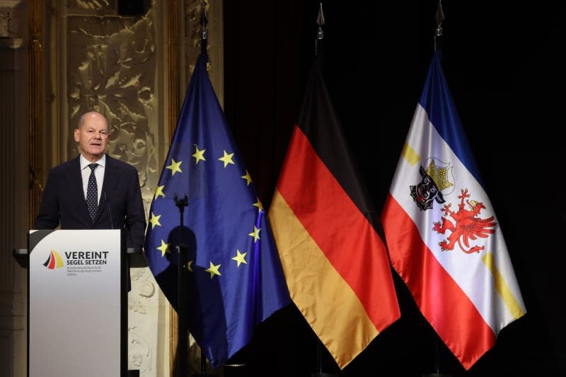 Germany's Chancellor Olaf Scholz speaks at the ceremony in the Mecklenburg State Theater. As part of the Bundesrat presidency, Schwerin is hosting the central celebrations for German Unity Day under the motto "Setting sail united". Jens Büttner/dpa POOL/dpa