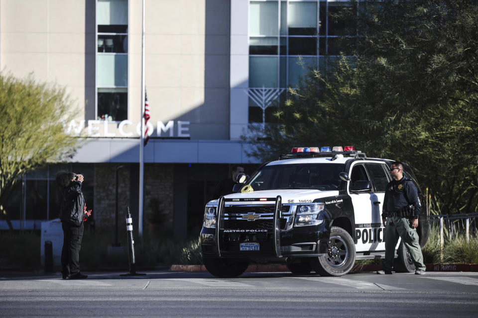 Police stand guard at Sunrise Hospital and Medical Center after an active shooter event that killed several people at University of Nevada, Las Vegas in Las Vegas, Wednesday, Dec. 6, 2023. The attack just before noon sent police swarming onto the campus, which is just a couple of miles from the world-famous Las Vegas Strip while students barricaded themselves in classrooms. (Rachel Aston/Las Vegas Review-Journal via AP)
