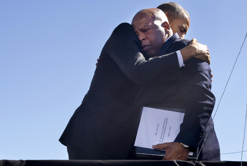 President Barack Obama embraces Rep. John Lewis, D-Ga., after Lewis introduced the president with an emotional speech by the Edmund Pettus Bridge in Selma, Ala., on the 50th anniversary of "Bloody Sunday," a landmark event of the civil rights movement, Saturday, March 7, 2015. (Phhoto: Jacquelyn Martin/AP) 
