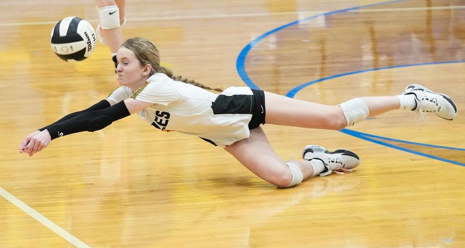 Avon Orioles defensive specialist Brittain Bills (3) hits the ball Saturday, Oct. 21, 2023, during the IHSAA Class 3A sectional semifinal at Greenfield-Central High School in Greenfield. The Roncalli Royals defeated the Avon Orioles in three sets.