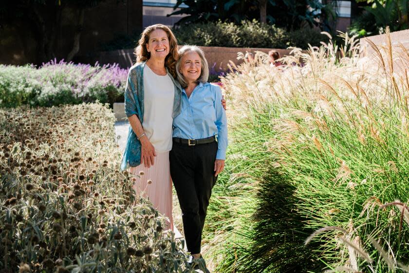 Los Angeles, CA - October 31: (Right) Wendy Garen, the recently retired president and CEO of the Ralph M. Parsons Foundation and Kate Anderson, the center's executive director pose for a portrait in Grand Park on Tuesday, Oct. 31, 2023 in Los Angeles, CA. (Jason Armond / Los Angeles Times)