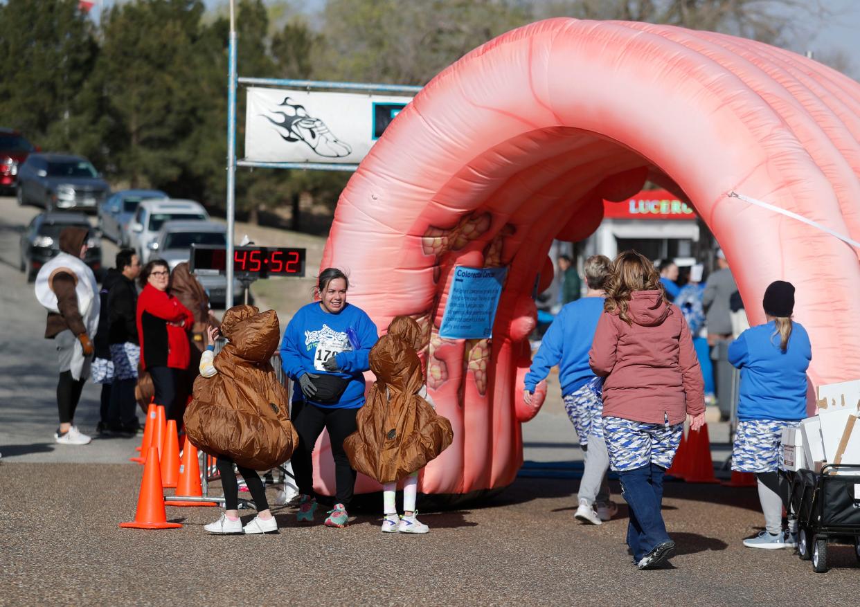 Casey Swindell (1707) stands at the finish after the run. Runners competed in the 2023 Lubbock Undy Run at Mae Simmons Park Saturday, Mar. 25, 2023 to benefit the Colorectal Cancer Alliance.