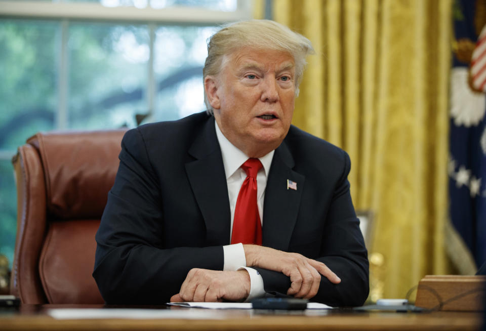 President Donald Trump speaks during an interview with The Associated Press in the Oval Office of the White House, Tuesday, Oct. 16, 2018, in Washington. (AP Photo/Evan Vucci)