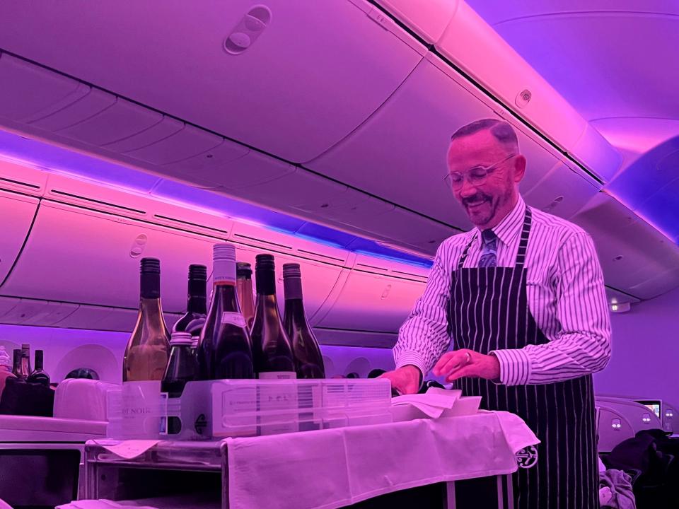 An Air New Zealand business class flight attendant.