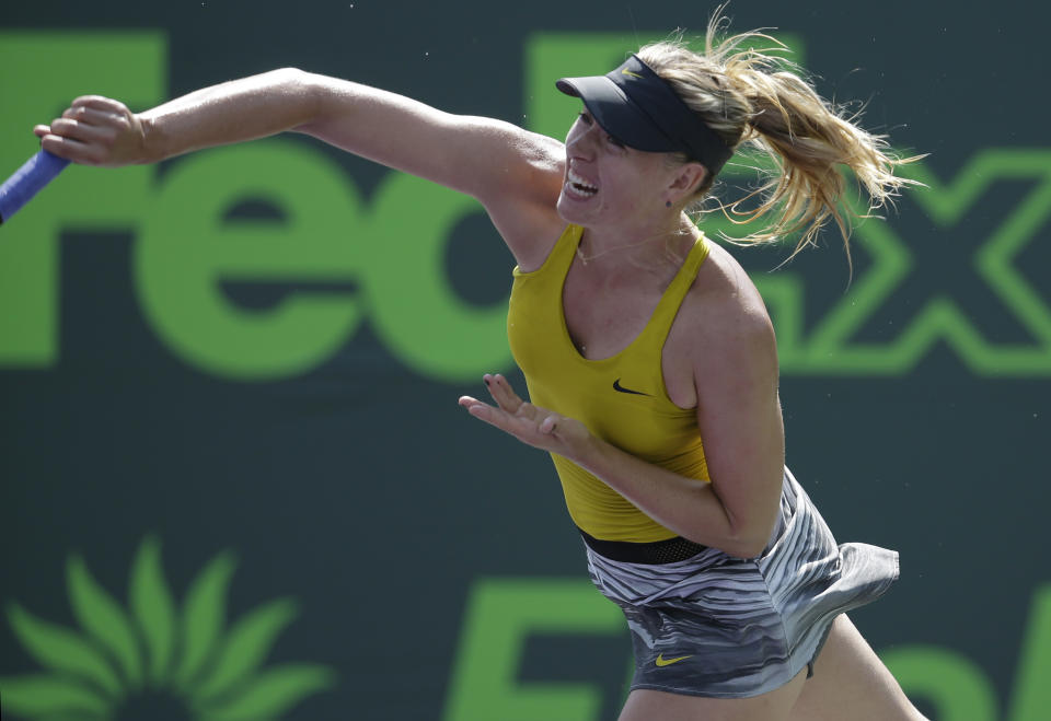 Maria Sharapova, of Russia, serves to Kirsten Flipkens, of Belgium, at the Sony Open tennis tournament, Monday, March 24, 2014, in Key Biscayne, Fla. (AP Photo/Lynne Sladky)