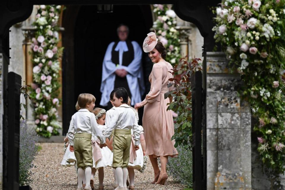 Kate with the bridesmaids and pageboys as they wait for sister Pippa. (Getty Images)