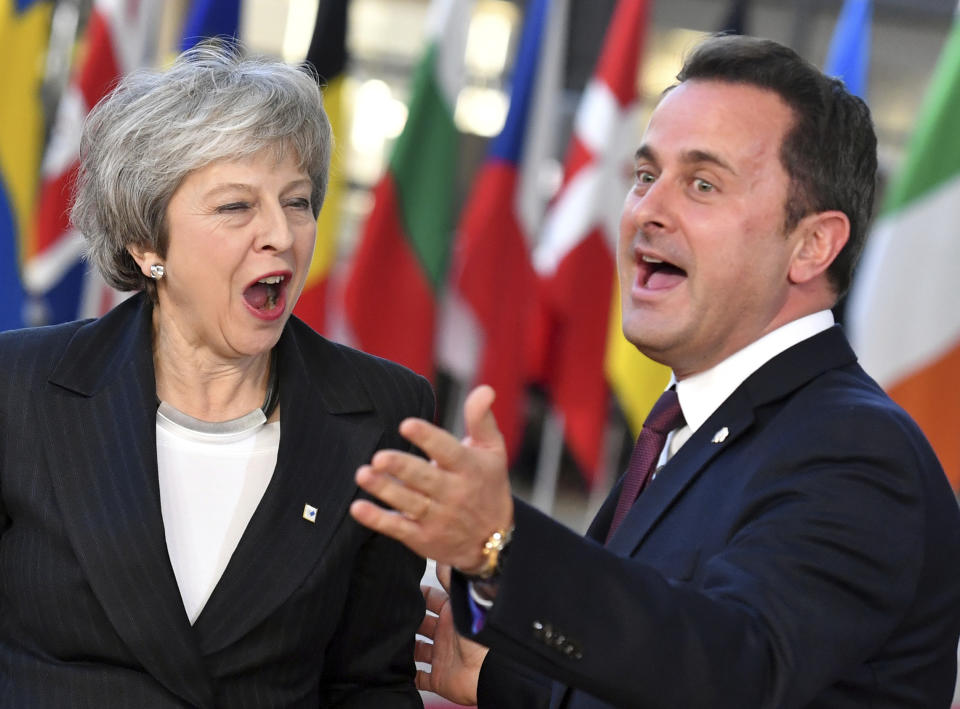 British Prime Minister Theresa May, left, speaks with Luxembourg's Prime Minister Xavier Bettel as she arrives for an EU summit in Brussels, Thursday, Dec. 13, 2018. EU leaders gather for a two-day summit, beginning Thursday, which will center on the Brexit negotiations. (AP Photo/Geert Vanden Wijngaert)