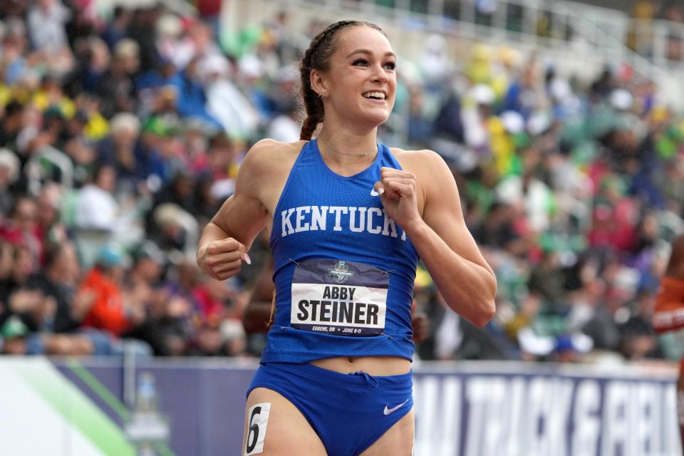 Abby Steiner of Kentucky celebrates after winning the women's 200m in a collegiate record 21.80 on Saturday.