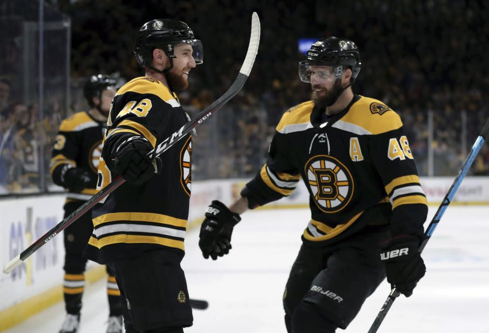 <p>
              Boston Bruins' Matt Grzelcyk, left, celebrates his goal against the Carolina Hurricanes with David Krejci during the second period in Game 2 of the NHL hockey Stanley Cup Eastern Conference final series, Sunday, May 12, 2019, in Boston. (AP Photo/Charles Krupa)
            </p>