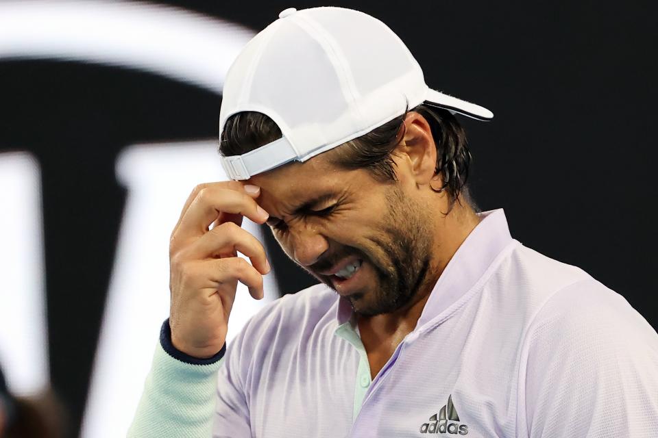 Fernando Verdasco reacts in pain as he plays against Germany's Alexander Zverev during their men's singles match on day six of the Australian Open.