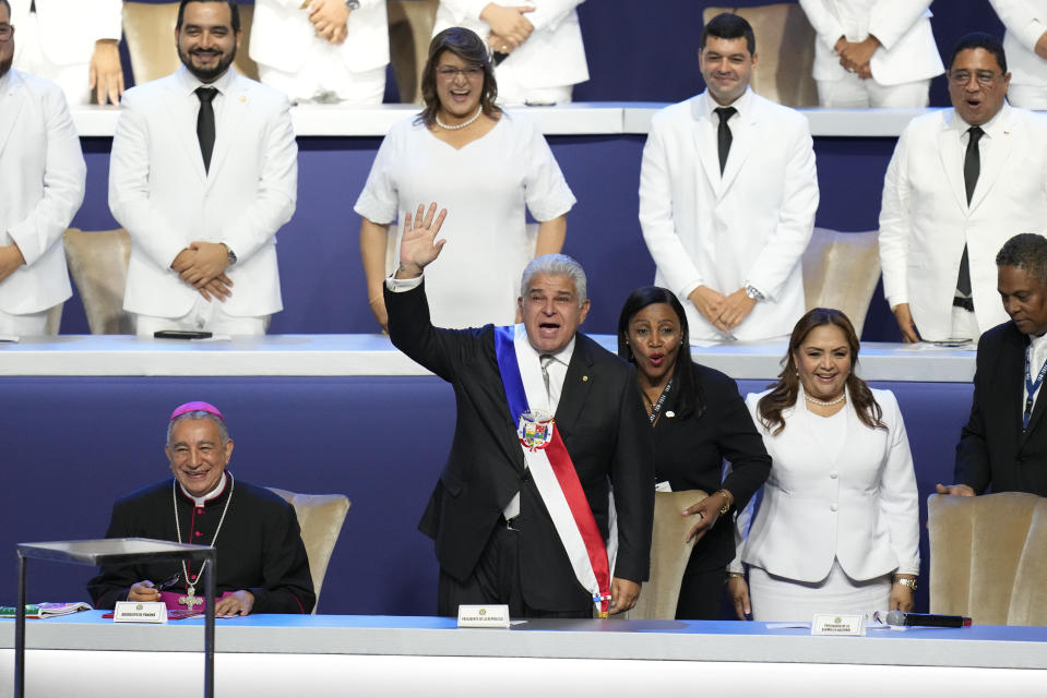 New Panamanian President Jose Raul Mulino waves before giving a speech at his swearing-in ceremony at the Atlapa Convention Centre in Panama City, Monday, July 1, 2024. (AP Photo/Matias Delacroix)